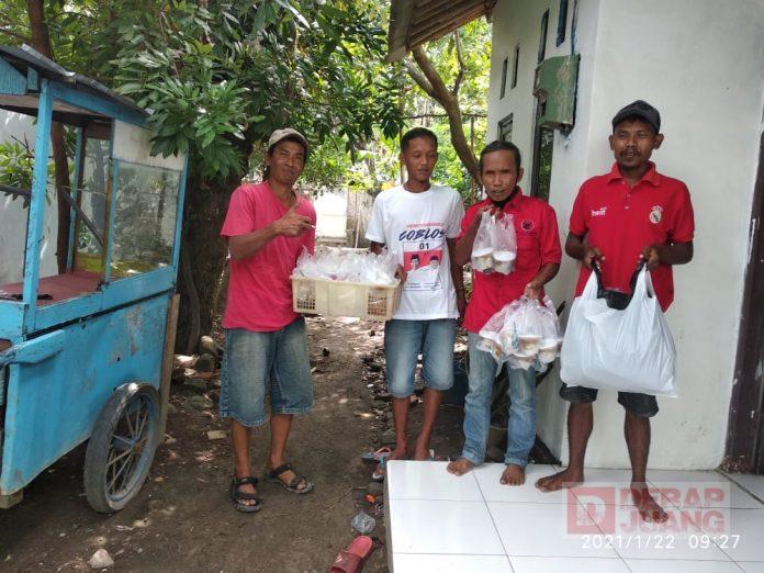 PAC PDI Perjuangan Margadana Bersama Ketua Ranting Cabawan Bagikan Nasi Bungkus Kepada Masyarakat
