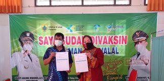 Berstatus Penyintas Covid-19, H. Junaedi dan Istri Jalani Vaksinasi